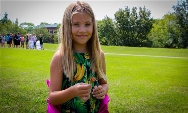 Girl has butterfly on her finger